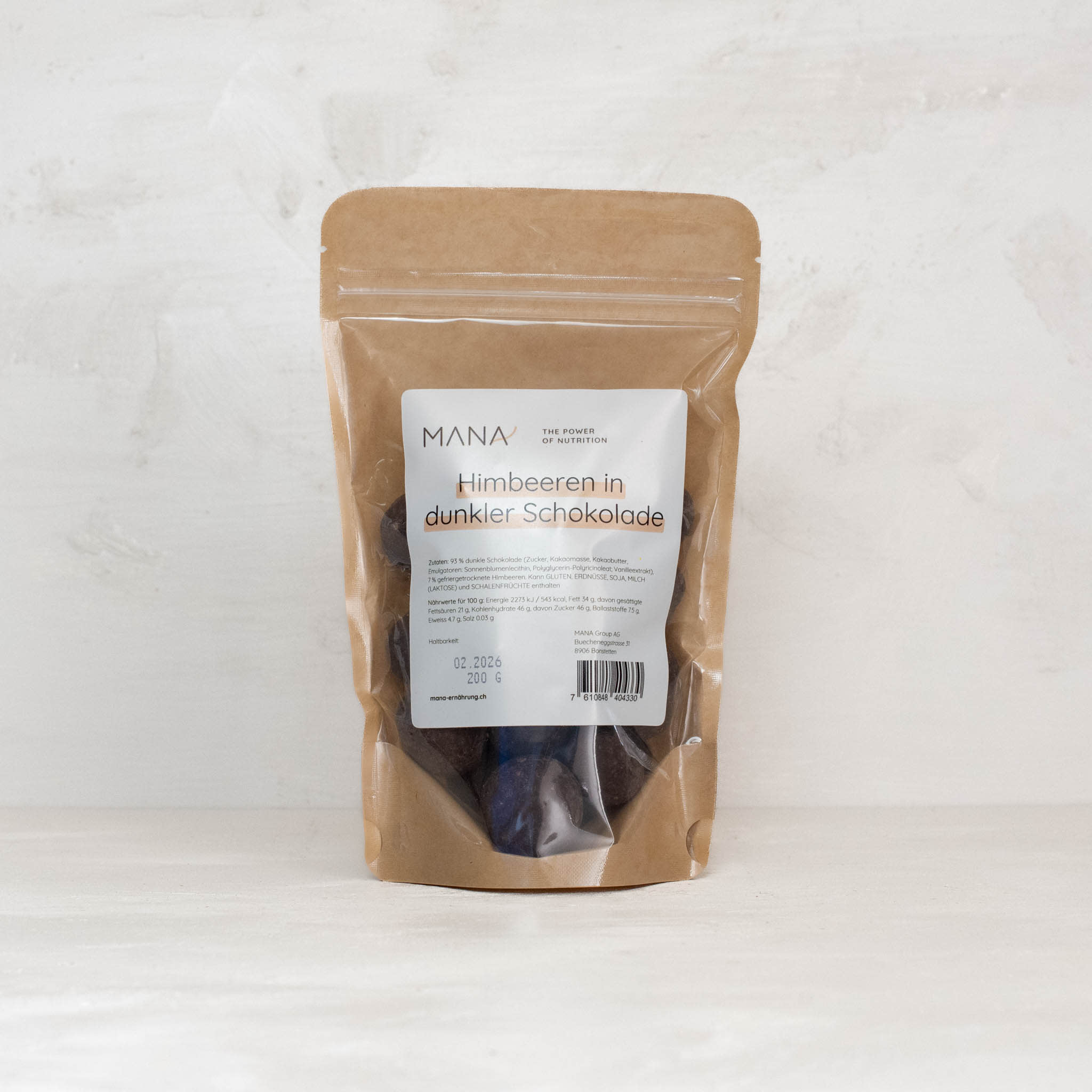 Himbeeren in dunkler Schokolade im Beutel